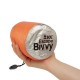 SOL Escape Bivvy Orange – Lightweight and Easy to Carry SOL Escape Bivvy in bright orange, shown packed in hand for scale