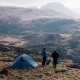 Wild Country Helm Elite 2 lightweight two-person tent pitched with trekking pole support and guy lines for stability