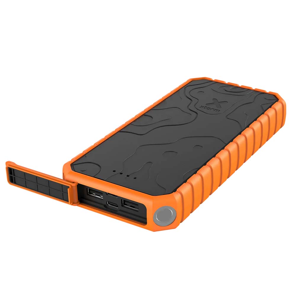 Xtorm Power Bank with USB Ports Exposed Xtorm rugged power bank with protective USB cover open showing multiple output ports.
