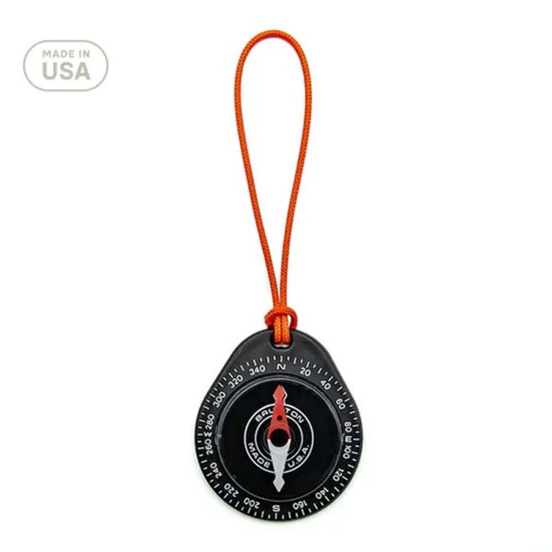 Front view of the Brunton Tag-Along 9040 Compass featuring a red lanyard and compact black design, made in the USA