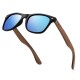 Polarised sunglasses by Oi Wood featuring blue reflective lenses and walnut wood arms