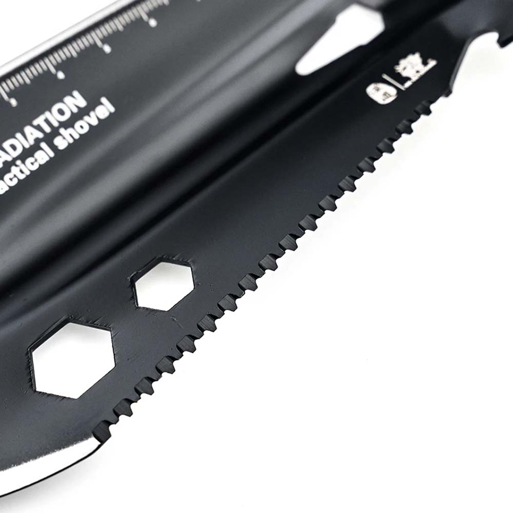Serrated Edge Close-Up of SOG Tactical Shovel Close-up of the serrated edge and hex wrench cutouts on SOG mini shovel blade
