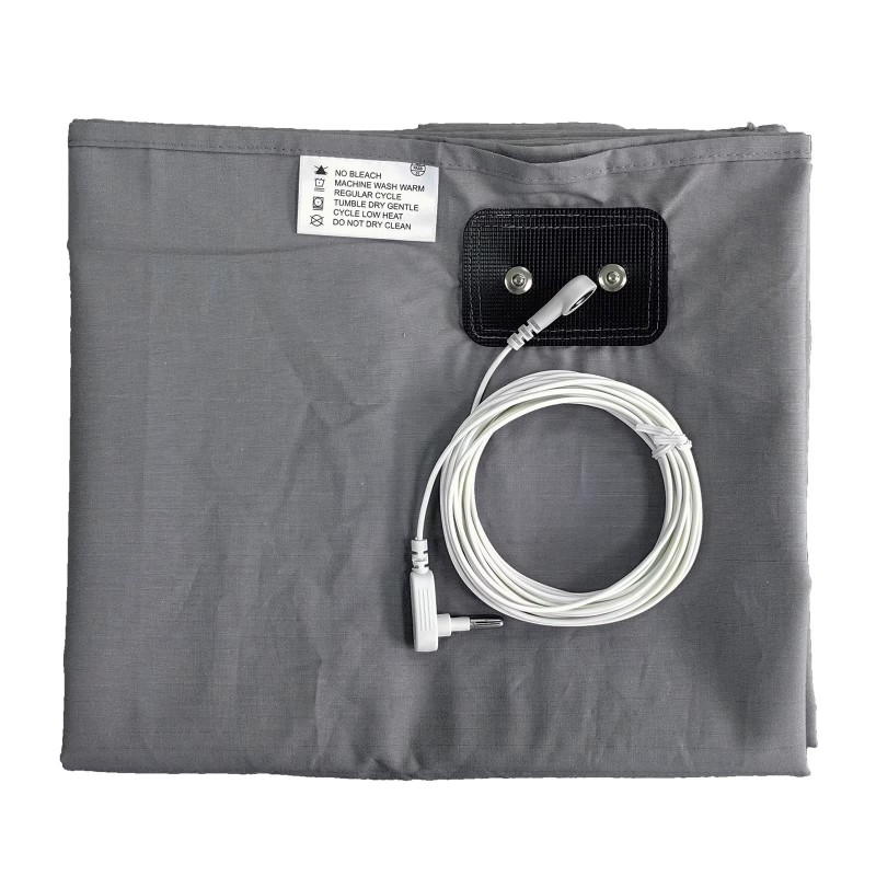 Folded grey grounding bedsheet with attached connection panel and coiled earthing cord