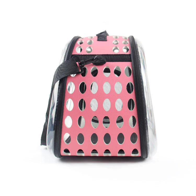 Transparent Pet Carrier Bag for Dogs and Cats Pink transparent pet carrier bag with clear front panel, ventilation holes, mesh side window and shoulder strap for small dogs and cats.