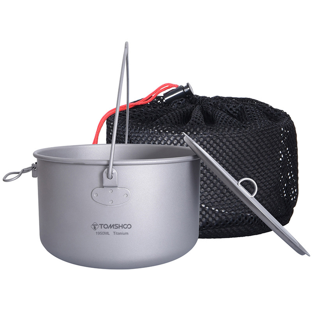 Image of a lightweight titanium pot with folding handle and measurement marks by Tomshoo.