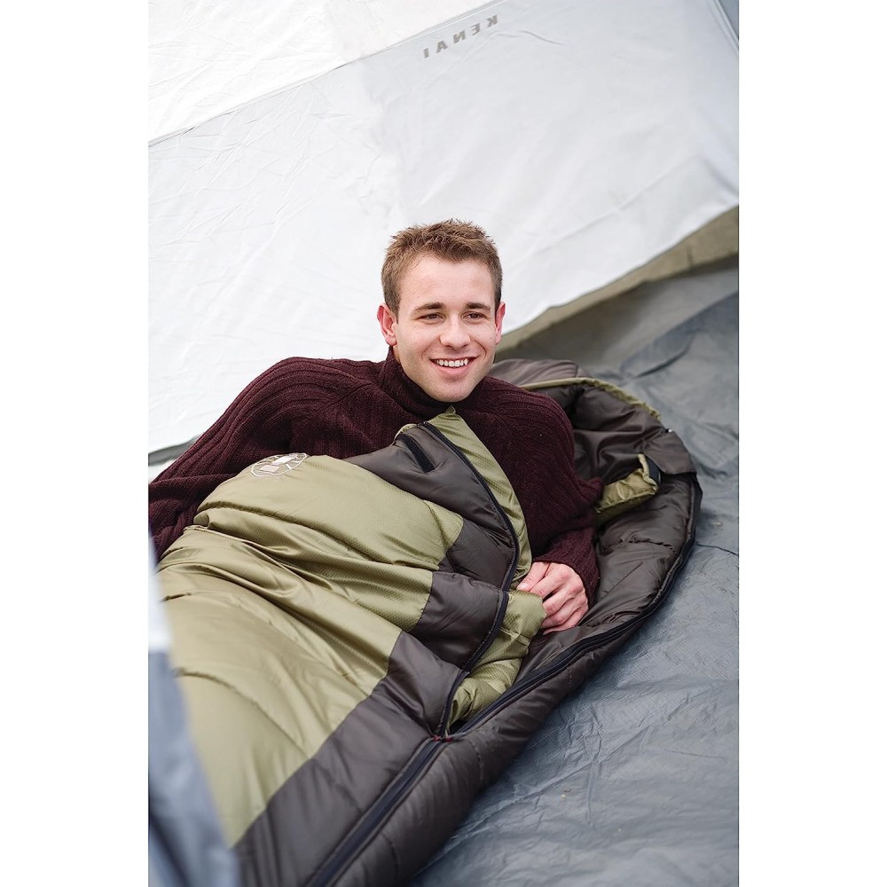 Olive-colored mummy-style sleeping bag by Coleman suitable for all seasons.