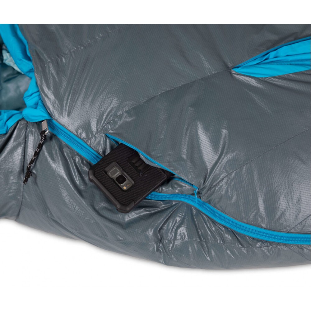 Woman's Nemo Kayu sleeping bag showcasing its ultralight design and premium down filling.