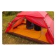Yellow Widesea insulated sleeping mat set up inside red backpacking tent on grassy campsite