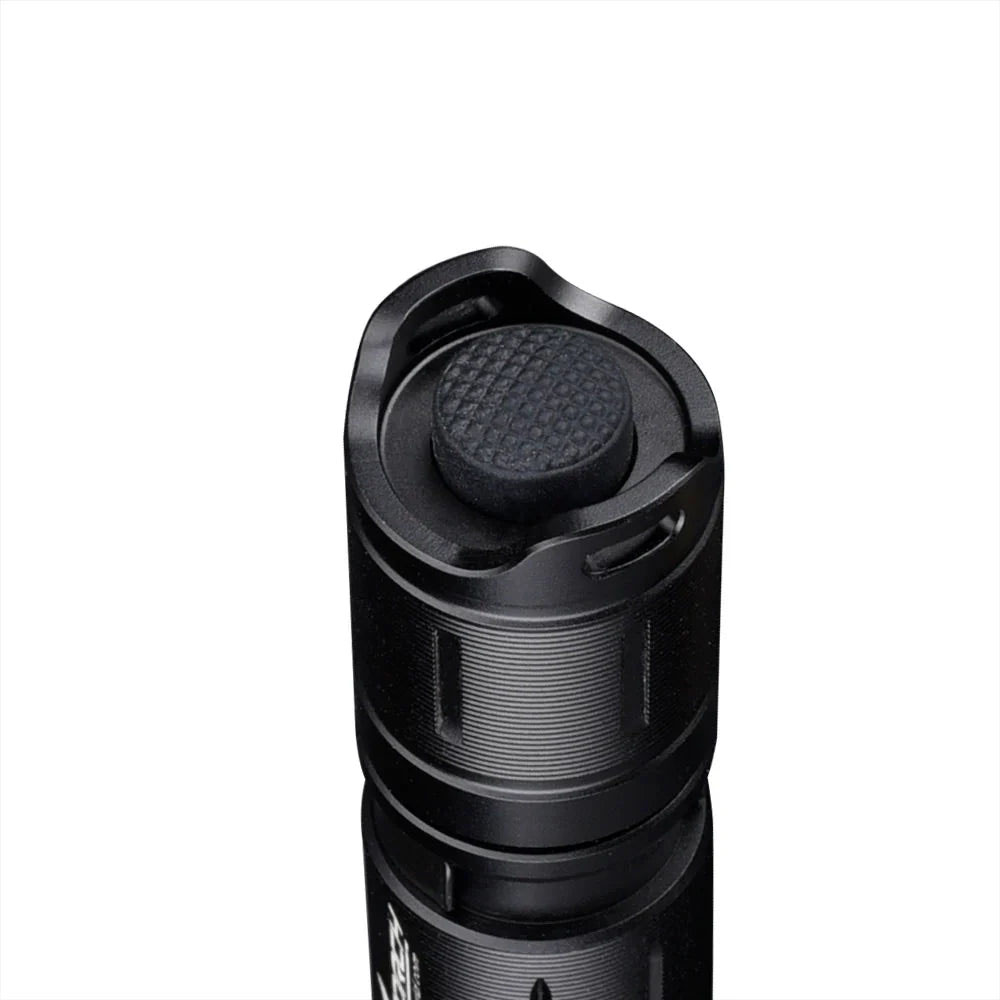 White Fitorch P50 flashlight shown at an angle, highlighting textured grip, power button, and front bezel