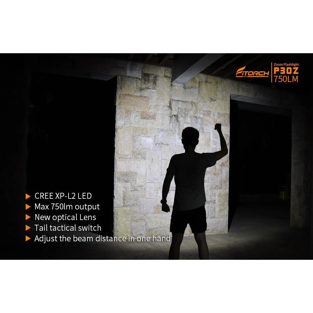 Angled view of the black Fitorch P200 flashlight with side button and large head