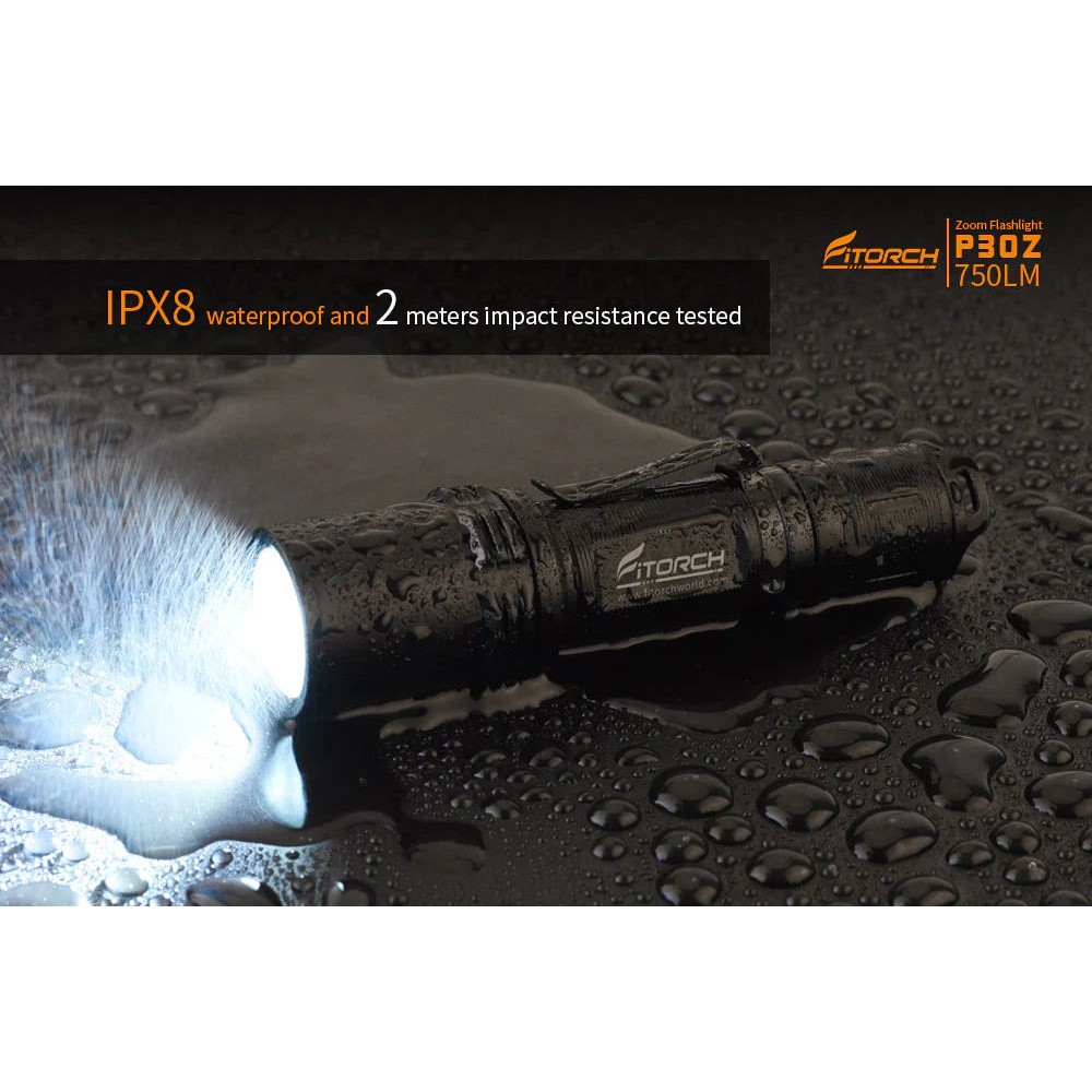 Angled view of the black Fitorch P200 flashlight with side button and large head