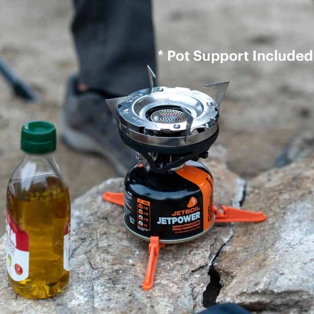 Jetboil MiniMo Cooking System in Action – Outdoor Cooking with Pan Support Jetboil MiniMo stove with pot support in use outdoors, cooking with skillet and Jetpower fuel canister