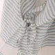 Soft Striped Cotton Fouta Poncho with Tie Detail Close-Up Close-up of blue striped cotton fouta poncho showing soft woven texture tie fastening and lightweight breathable beach towel fabric detail