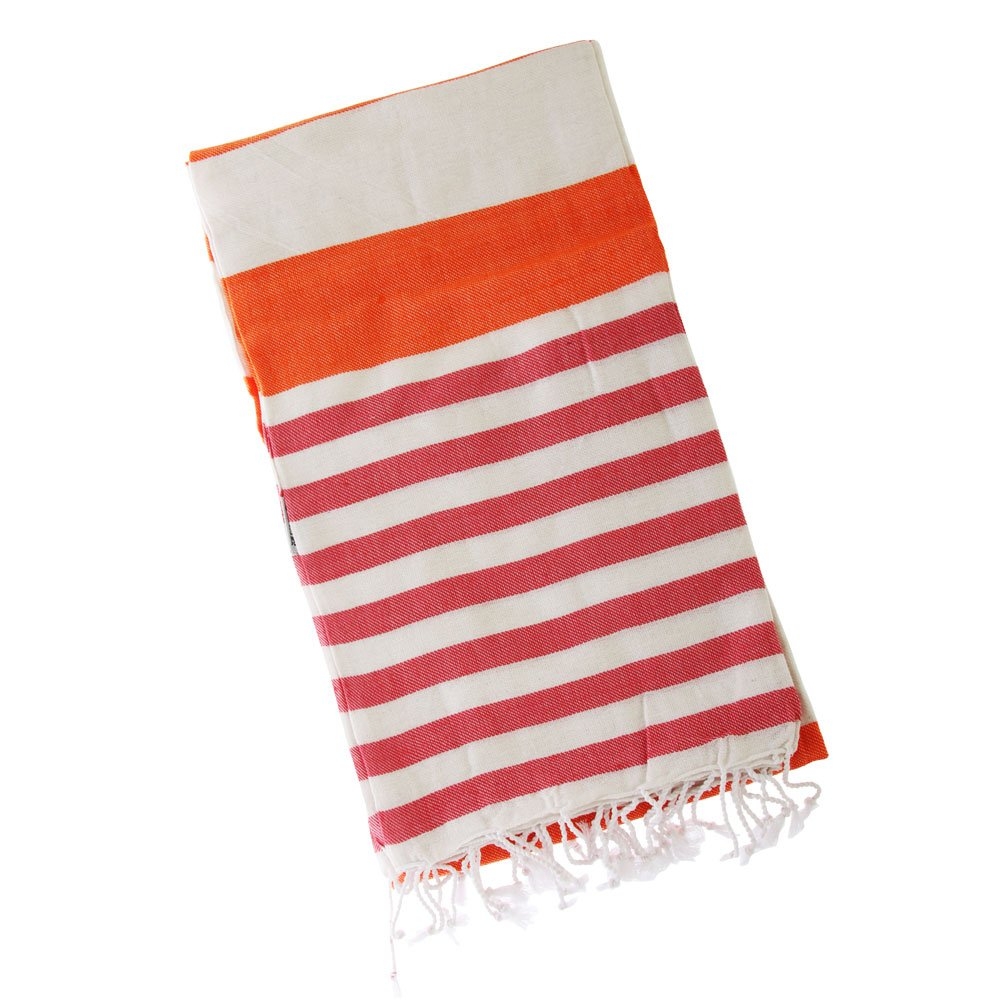 Folded Turkish hand-loomed flat-weave cotton beach towel in tangerine orange red and cream stripes with tassel fringe lightweight quick dry design for beach and travel use