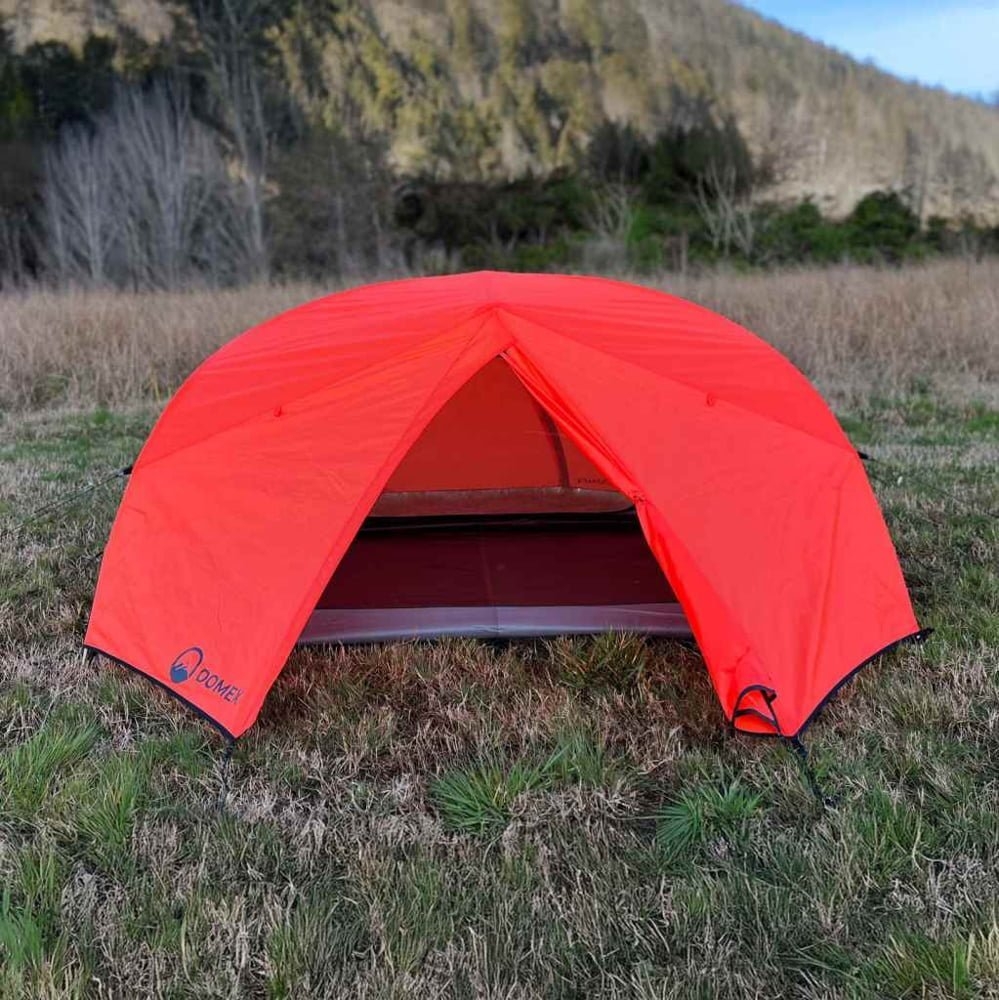 Domex Scout lightweight 1-2 person backpacking dome tent in bright orange designed for hiking, camping and outdoor adventures