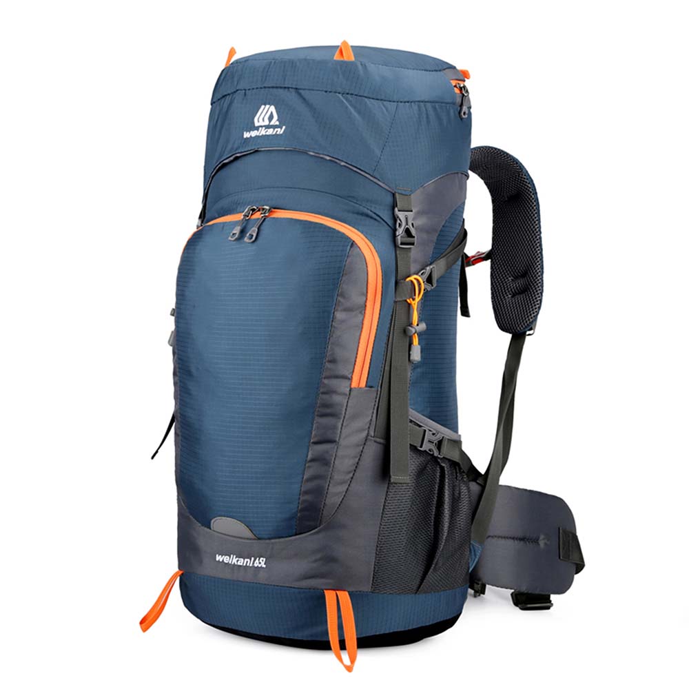 Hiker with a 65L backpack showcasing its multiple features on a mountain trail