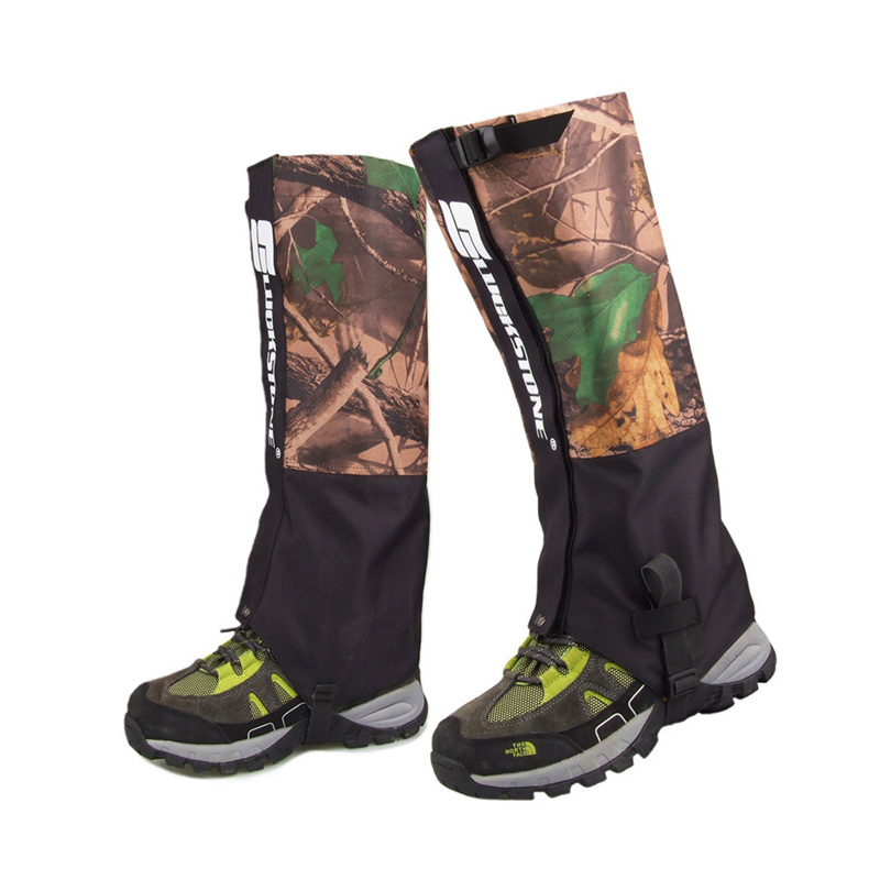 Camouflaged Hiking Gaiters - Front View Waterproof camouflage hiking gaiters shown from the front, covering boots and lower legs for protection in rugged terrain.